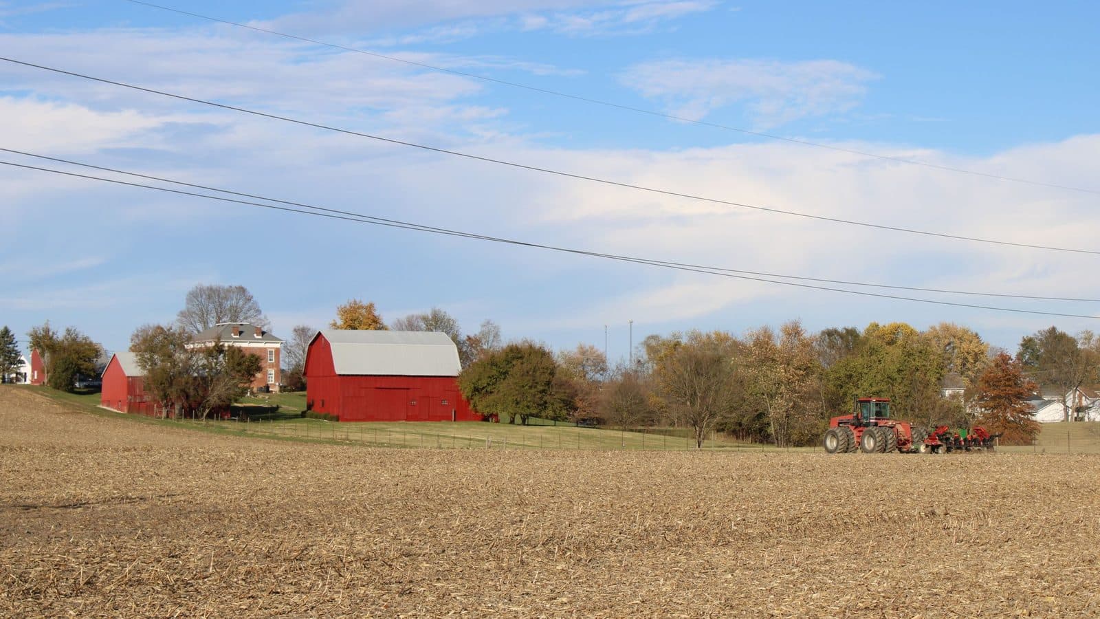 A red barn and tractor on Ohio farmland