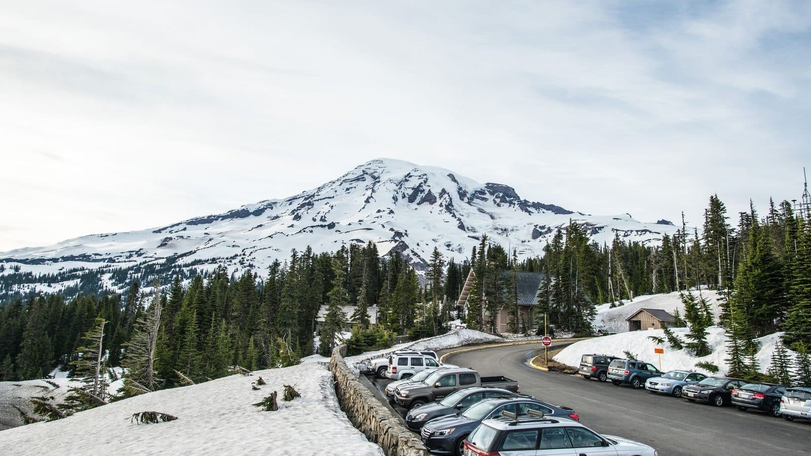 A snow-covered Washington mountain rising above the treeline