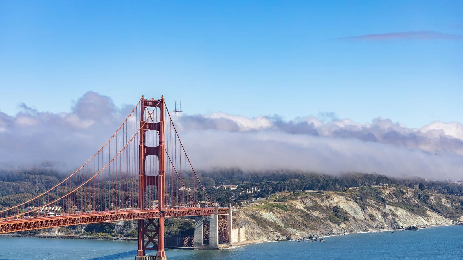 The Golden Gate Bridge rising above low fog in California